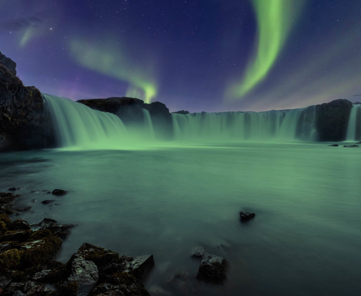 Aurora Borealis over Godafoss waterfall in Iceland