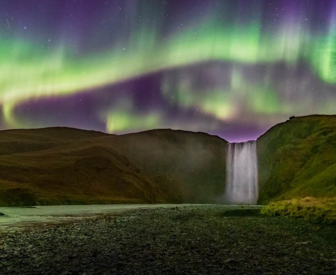 Aurora Borealis over Skogafoss waterfall in Iceland