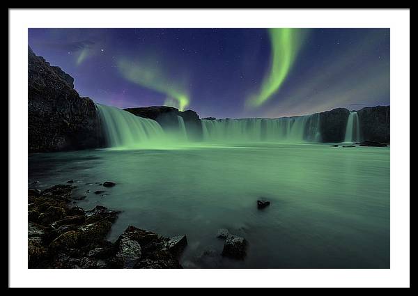 Aurora Borealis over Godafoss Waterfall in Iceland