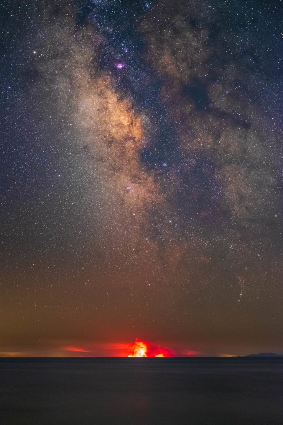 the milky way over the wildfires of evia island in greece