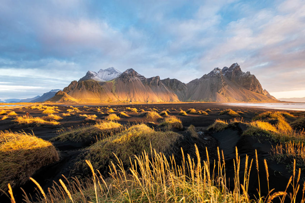 Sunrise at Vestrahorn mountain and Stokksness Black Sand Beach in Iceland