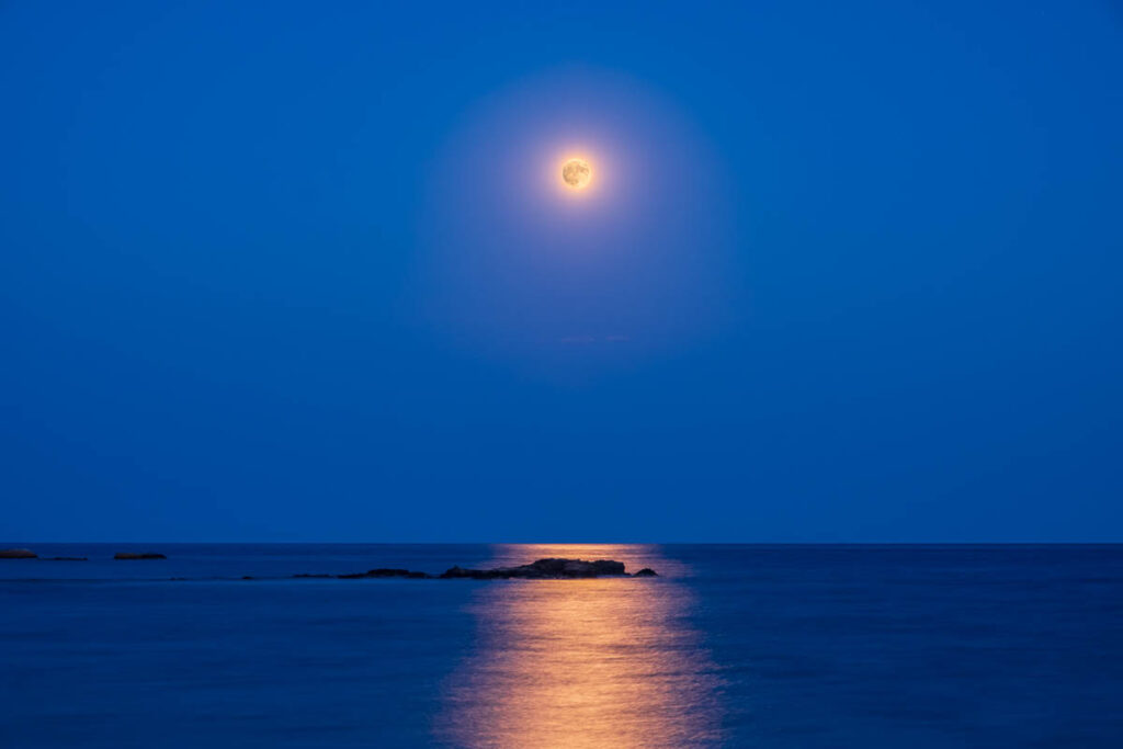 Full Moon Rising over the Sea
